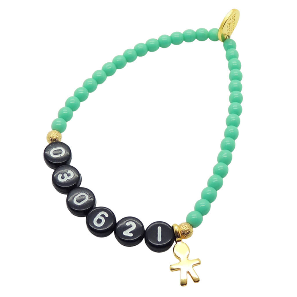 A Dana Levy aqua coloured newborn baby milestone glass bead bracelet with birth date in black acrylic letters and a gold plated mini boy icon charm, on a white background. 