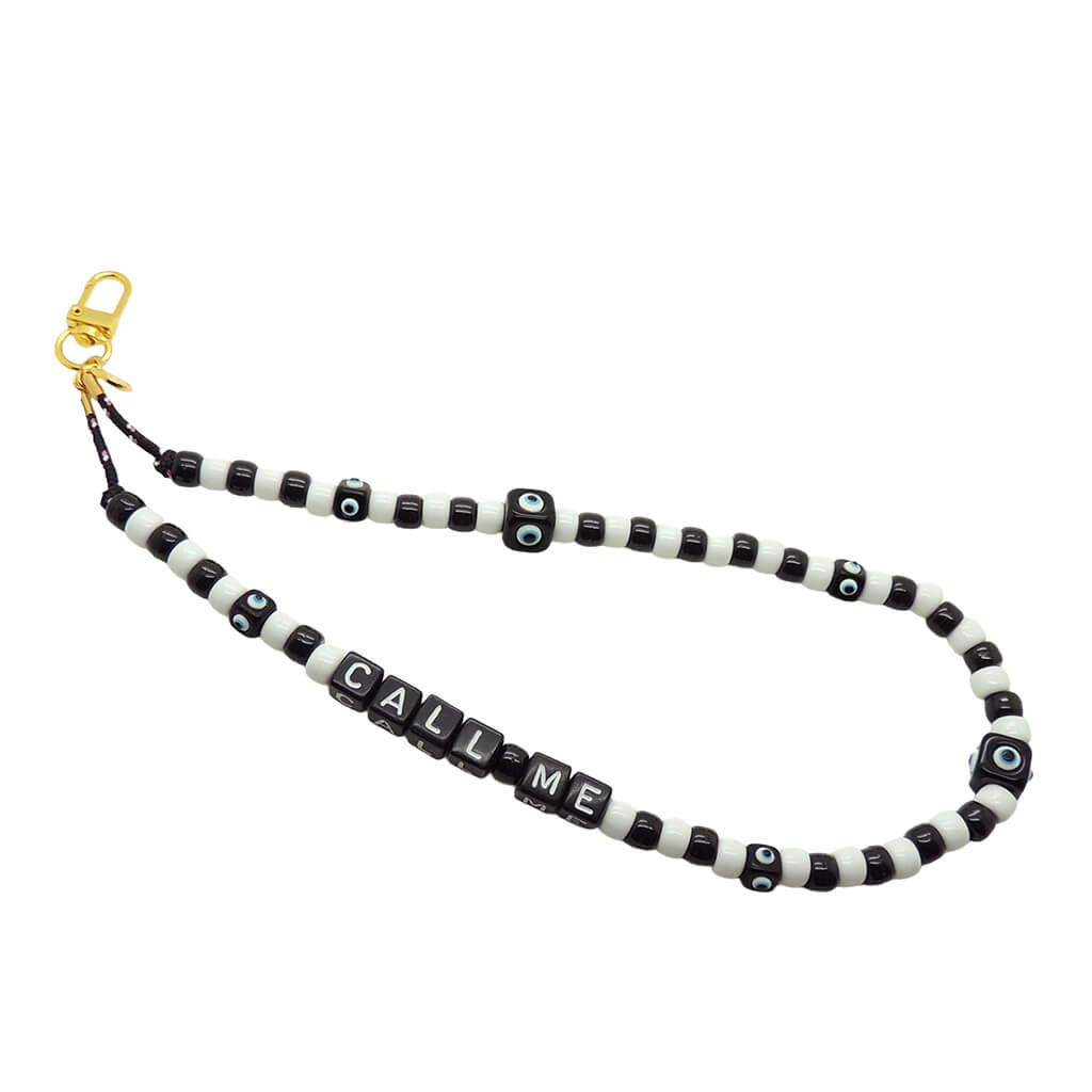 Dana Levy black and white beaded phone charm strap with 'CALL ME' beads on a white background