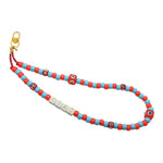 Dana Levy CIAO beaded phone charm strap with colourful beads and a gold clip on a white background