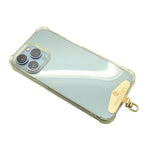 Dana Levy Clear iphone case with front of gold metal phone charm strap card on a white background.