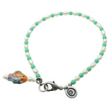 Dana Levy porcelain fish charm freshwater pearl glass bead mix anklet with aqua glass beads and antique silver clasp on a white background. 