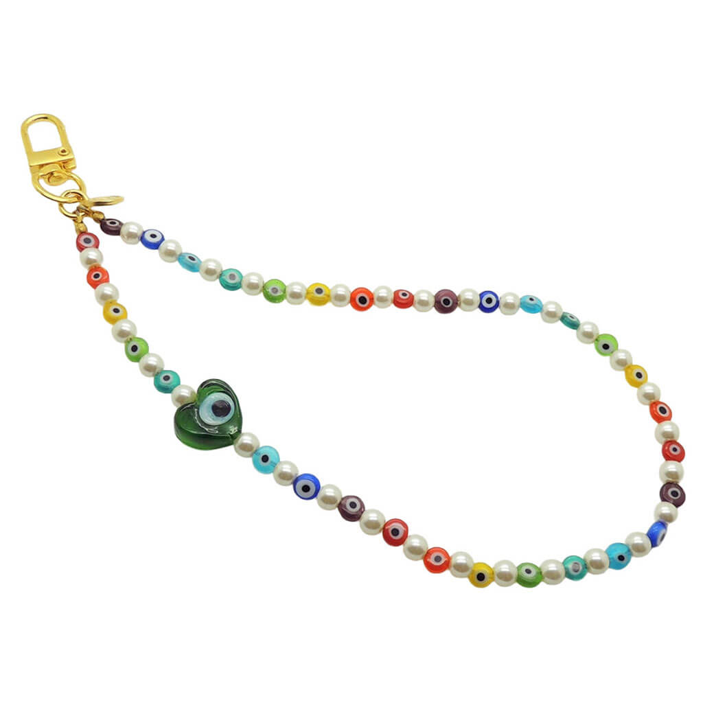 Dana Levy rainbow glass evil eye heart faux pearl beaded phone wristlet strap with a transparent green evil eye heart charm on a white background.