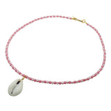 Dana Levy beaded necklace with dark rose and white/red stripe glass beads and a cowrie shell pendant on a white background.