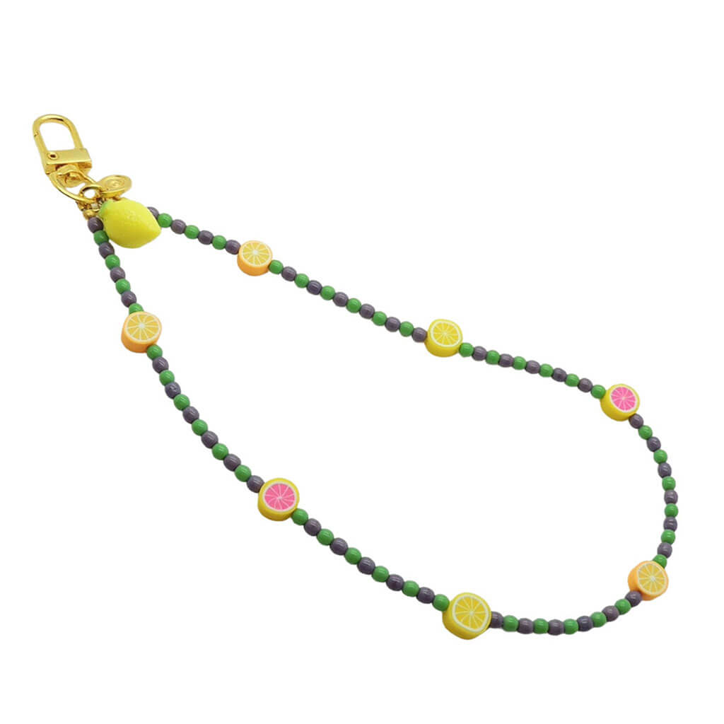 Dana Levy Sicilian tutti frutti charm glass bead phone wristlet strap with fruit mix, dark lilac and green glass bead mix on a white background.