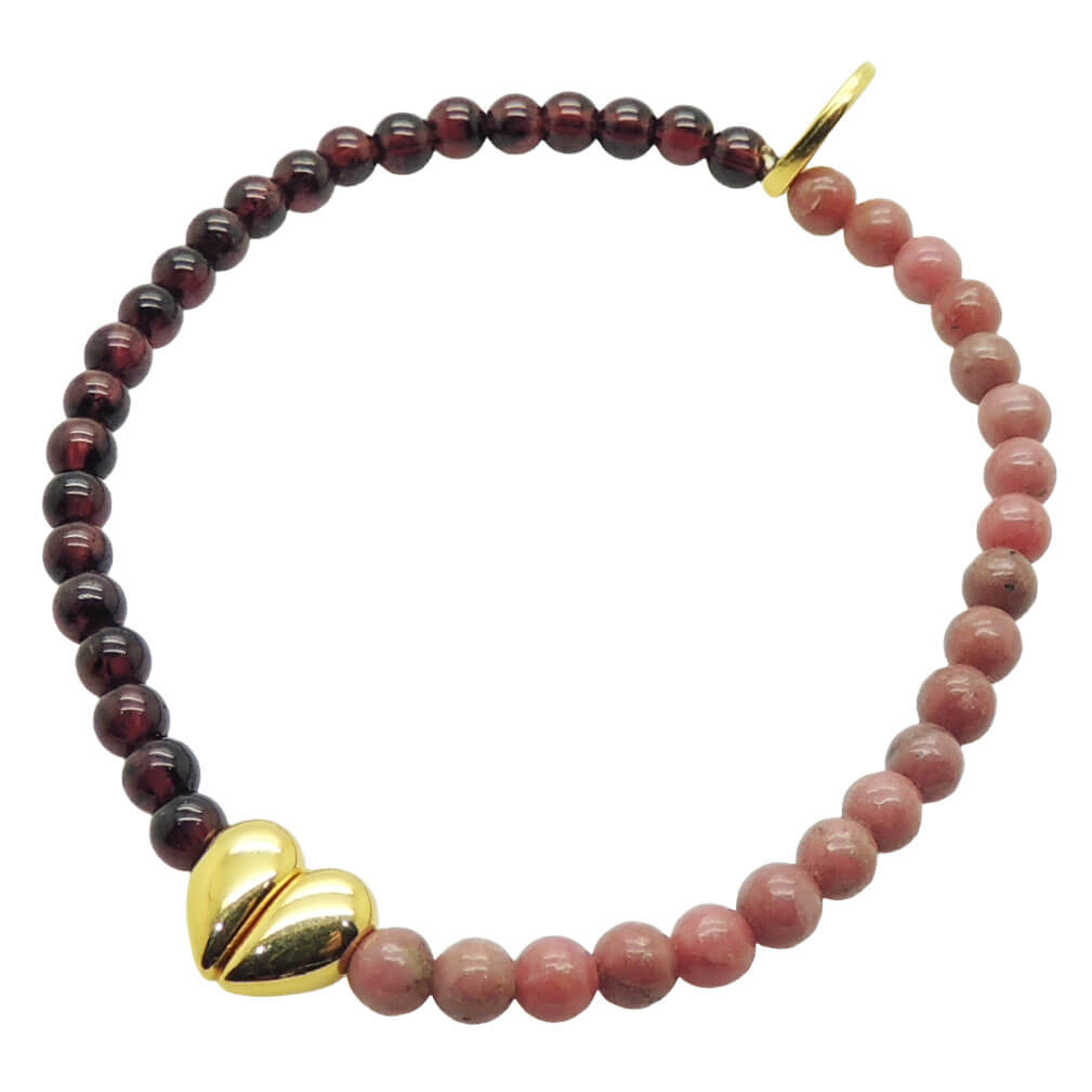 Dana Levy gemstone bracelet with garnet and rhodonite beads and a gold split heart charm on a white background.