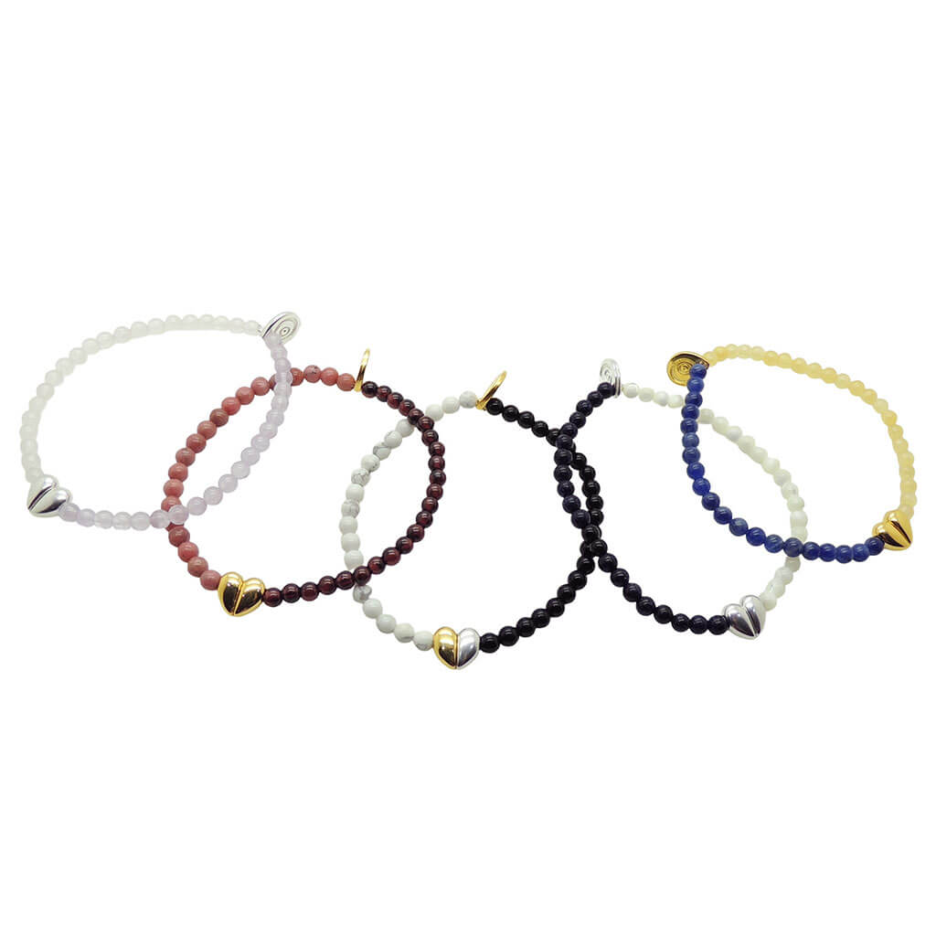 Dana Levy set of five split heart charm gemstone beaded bracelets on a white background.