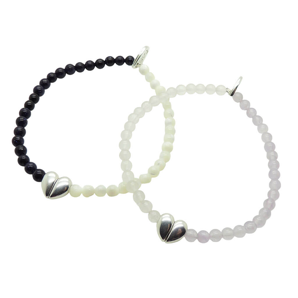 Dana Levy pair of two silver plated split heart charm gemstone bracelets on a white background. 