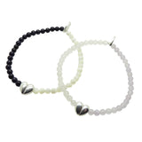 Dana Levy pair of two silver plated split heart charm gemstone bracelets on a white background. 