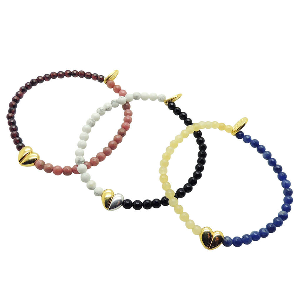 Dana Levy trio of split heart charm gemstone bracelets in various gemstones on a white background.