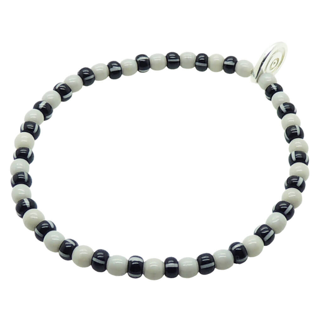 Dana Levy grey black and white striped beaded bracelet on a white background.