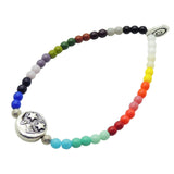 Dana Levy Multicoloured rainbow glass beaded bracelet with a silver moon charm in the centre on a white background