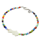 Dana Levy white bone fish charm balagan glass bead mix anklet with an antique silver plated clasp on a white background. 
