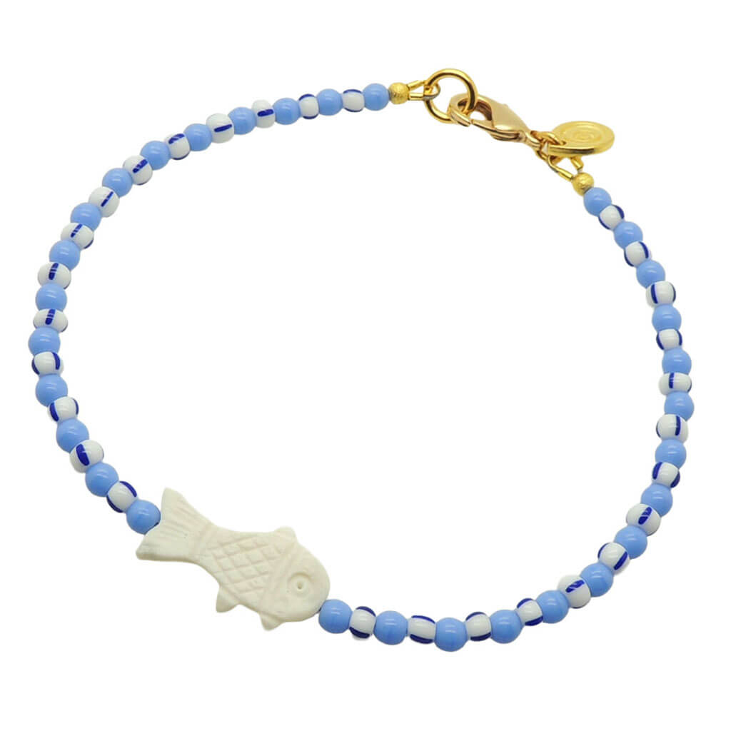 Dana Levy white bone fish charm striped glass bead mix anklet with cornflower blue glass beads and white/blue striped glass beads and a gold plated clasp on a white background.