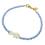 Dana Levy white bone fish charm striped glass bead mix anklet with cornflower blue glass beads and white/blue striped glass beads and a gold plated clasp on a white background.