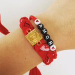 Dana Levy Red Alphabet Charm Bandana Braid Bracelet on Wrist with Amor Bracelet