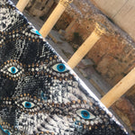 Dana Levy Snakeskin Evil Eye Silk Scarf - Cardo Old City Jerusalem Background