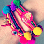 Dana Levy Neon Hamsa Hand Lucky Charm Pompom Bracelet - Pink on Wrist
