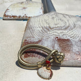 Dana Levy Seashell Charm Metallic Double Leather Cord Bracelet - Metallic Gold on Beach