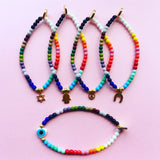 Dana Levy Mini Horseshoe Charm Rainbow Glass Bead Bracelet - Pink Background