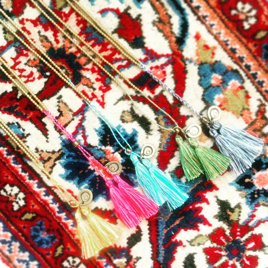 Dana Levy Men's Beaded Tassel Duo Necklace - Group on Persian Carpet Background
