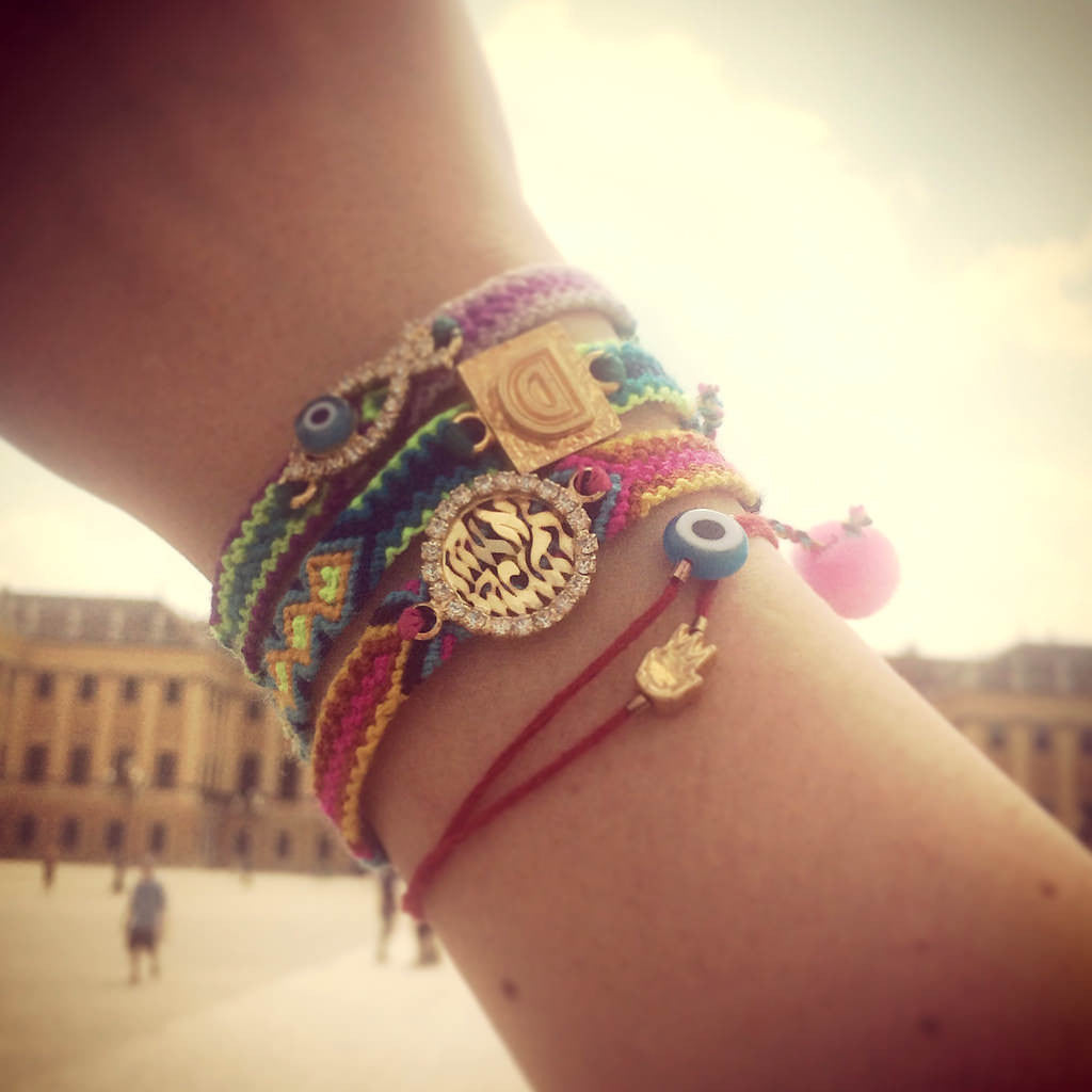 Dana Levy Mini Evil Eye Charm Red String Bracelet - on Wrist with friendship bracelets