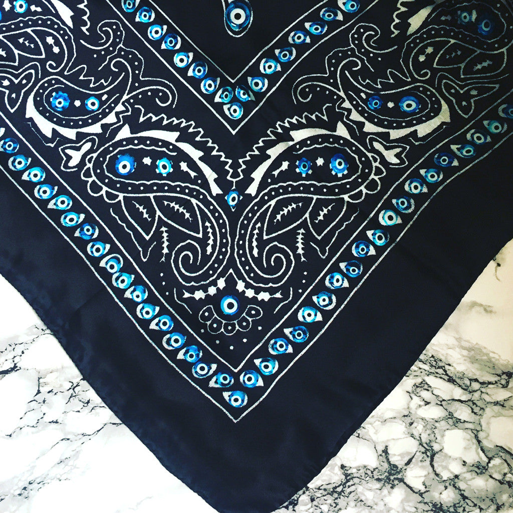 Dana Levy Evil Eye Bandana Silk Scarf - Detail on Marble Background
