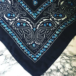 Dana Levy Evil Eye Bandana Silk Scarf - Detail on Marble Background