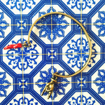 Dana Levy Mano Hand Cornicello Charm Cuff - on Portuguese Tile Background