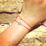 Dana Levy Evil Eye Red String Bracelet - on Wrist at Wailing Wall Jerusalem