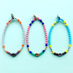 Dana Levy Solid Mini Hamsa Hand Charm Glass Bead Mix Bracelet - Trio on mint flatlay