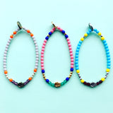 Dana Levy Solid Mini Hamsa Hand Charm Glass Bead Mix Bracelet - Trio on mint flatlay