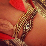 Dana Levy Mother of Pearl Evil Eye Charm Swarovski Crystal Ball Chain Bracelet - on Wrist with Multi Tassel Friendship Bracelet