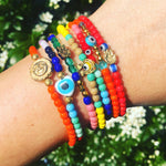 Dana Levy Solid Mini Horseshoe Evil Eye Charm Glass Bead Bracelet - on wrist