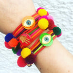 Dana Levy Neon Evil Eye Lucky Charm Pompom Bracelet - Group Stack on Wrist 