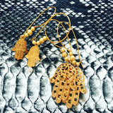 Dana Levy Filigree Hamsa Hand Hoop Earrings - Snakeskin Background 