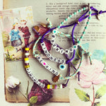 Dana Levy Personalised Name Alphabet Charm Cord Bracelet - Be Kind Flatlay
