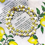 Dana Levy Smiley Charm Freshwater Pearl Choker and Necklace Medley Lemonade Background