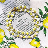 Dana Levy Smiley Charm Freshwater Pearl Choker and Necklace Medley Lemonade Background