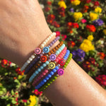 Dana Levy Multicolour Mini Flower Symbol Charm Glass Bead Bracelet - Colour Mix on Wrist 