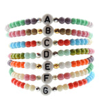 Dana Levy Initial Alphabet Letter Charm Glass Bead Bracelet - White A to G Stack