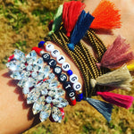 Dana Levy custom name glass Bead bracelets  that read Lets Go Glasto with friendship bracelets on a wrist. 