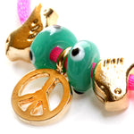 Dana Levy Peace Symbol and Dove Charm Satin Cord Bracelet - Detail of Gold on Neon Pink