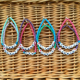 Dana Levy personalised name glass bead bracelets in bright coloured glass beads and our favourite Love Island contestants names in acrylic alphabet letters on a basket. 