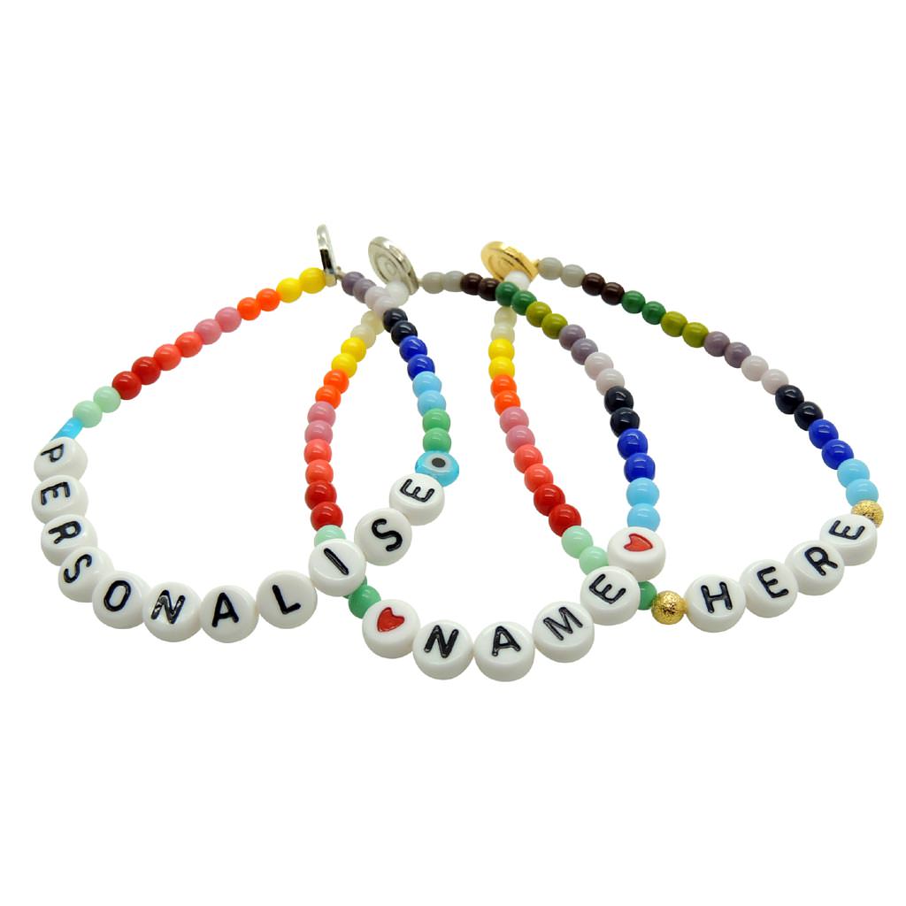 Dana Levy Personalised Name Alphabet Charm Rainbow Glass Bead Bracelets Trio that read Personalise Name Here, om a white background. 